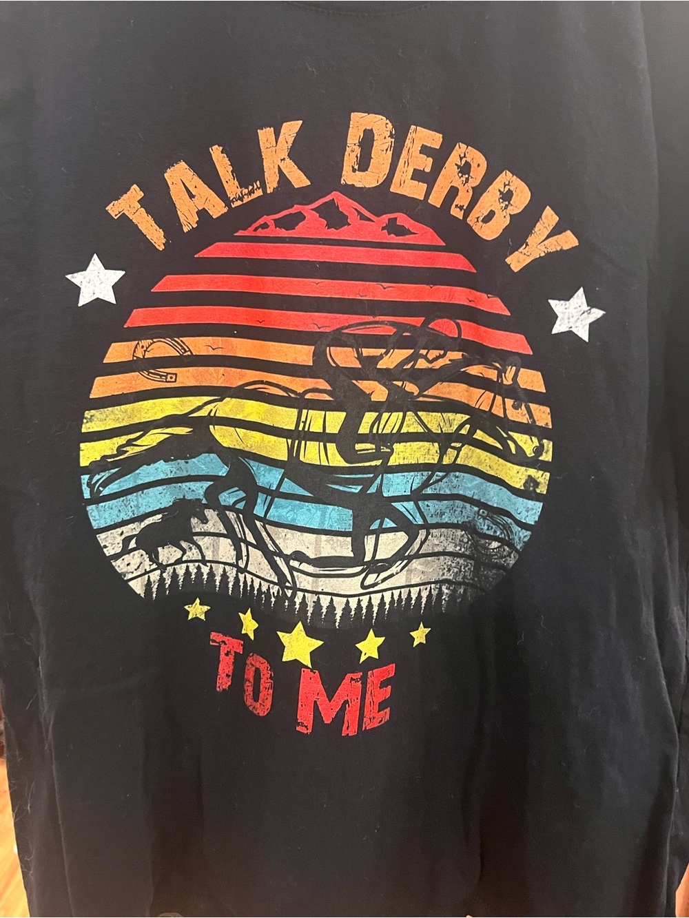 Talk Derby to Me Black Tee with Retro Rainbow Rodeo Graphic